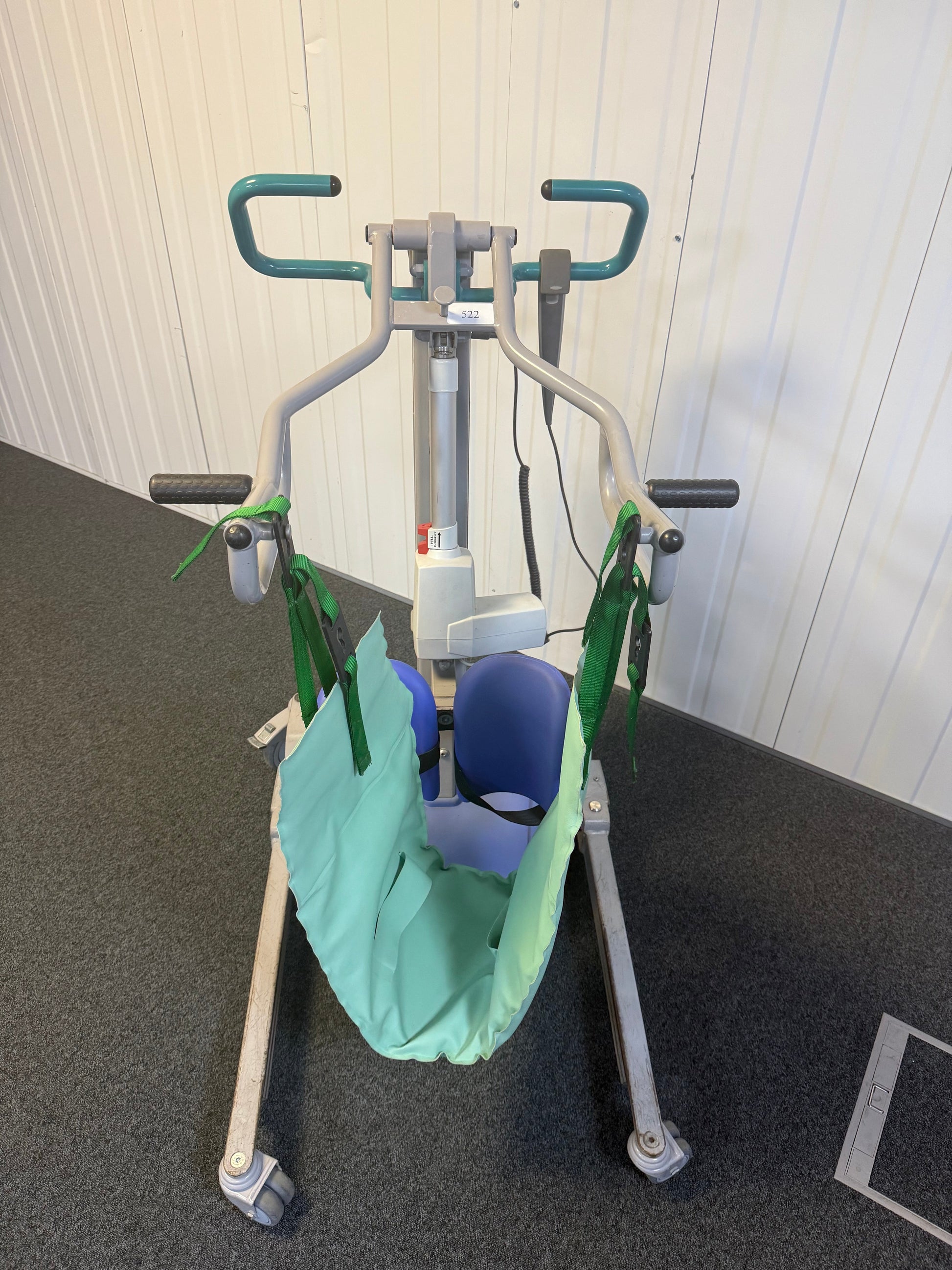 Front mast of Arjo electric hoist with emergency stop